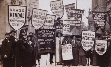 Postcard of men and women holding Cumbrian suffrage banners - LSE Library